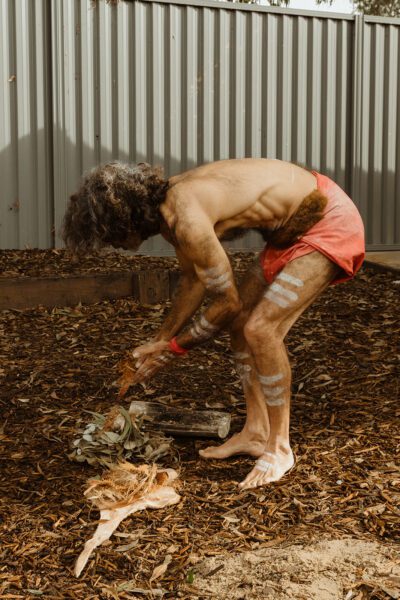 Uncle Les performing the traditional smoking ceremony